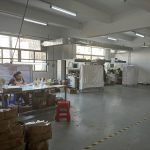 Enamel color filling workshop at Yuehui Gifts custom metal products factory