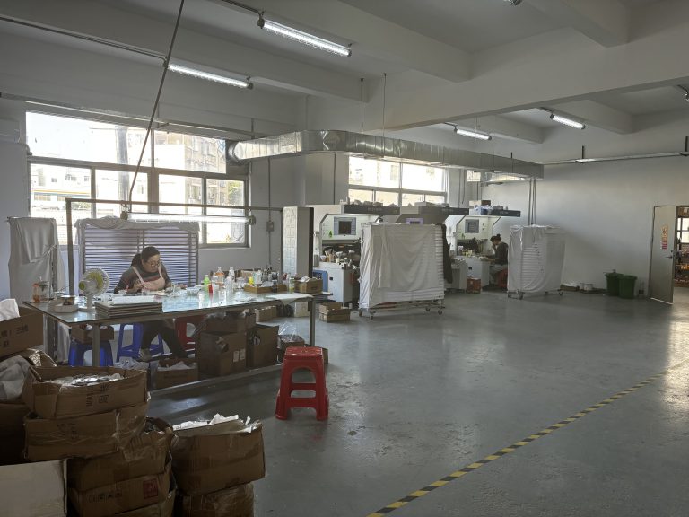 Enamel color filling workshop at Yuehui Gifts custom metal products factory